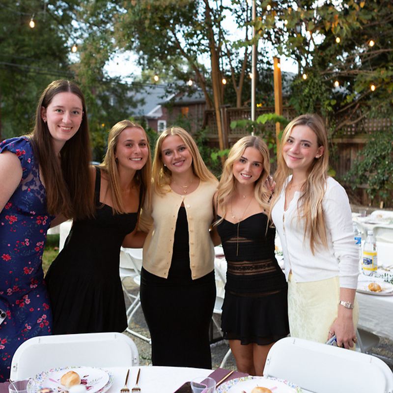 Friends dressed up together at Shabbat dinner